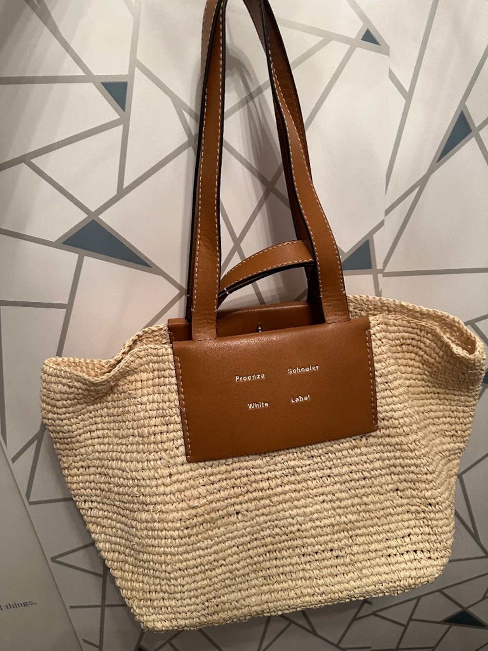 Proenza Schouler White Label straw tote bag with brown leather handles and front